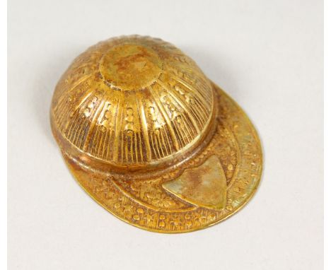 A BRASS JOCKEY CAP CADDY SPOON.