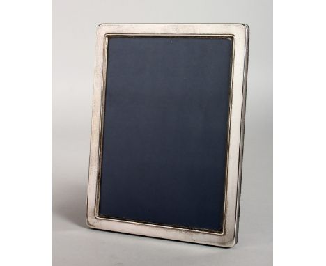 A PLAIN SILVER UPRIGHT PHOTOGRAPH FRAME. 8ins x 6ins.