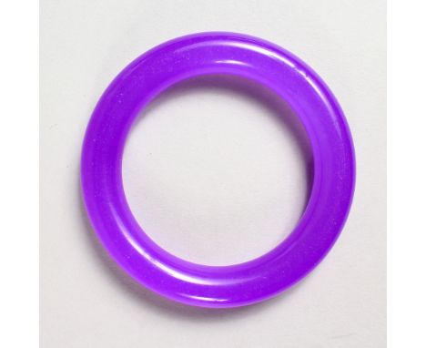 AN AMETHYST JADE BANGLE.