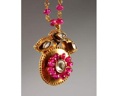 A GOOD VICTORIAN 18CT GOLD, RUBY AND DIAMOND PENDANT ON CHAIN, in original leather box.