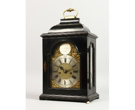 A SUPERB BRACKET CLOCK by SIMON DE CHARMERS, LONDON, in an ebony case with brass carrying handle, glass sides and door, with 