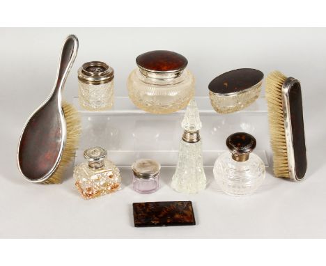 SEVEN SILVER TOP SCENT BOTTLES and TWO BRUSHES.