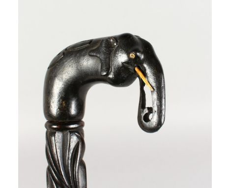 A CEYLONESE ELEPHANT HEAD WALKING STICK. 36ins long.