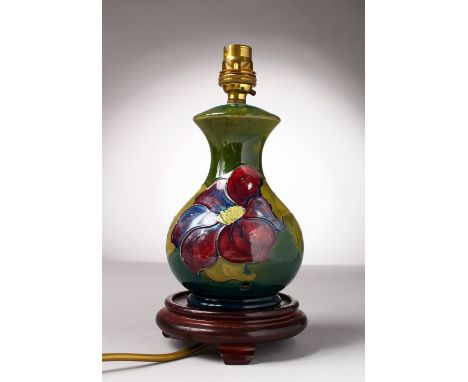 A MOORCROFT POTTERY LAMP with shade and base.