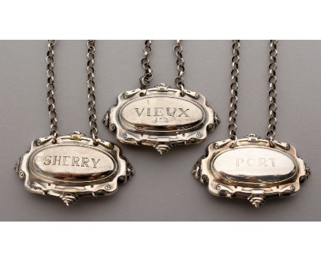 A SET OF THREE PLATED DECANTER LABELS, Port, Sherry and Vieux.