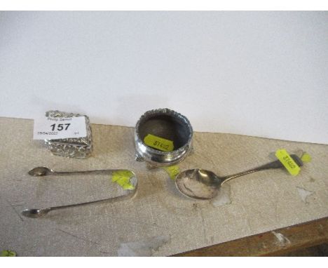 A lozenge shaped silver patch box, salt, spoon and sugar tongs