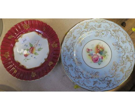 A Royal Worcester plate, decorated with roses by M Hunt, cracked, diameter 10.5ins, together with another Royal Worcester pla
