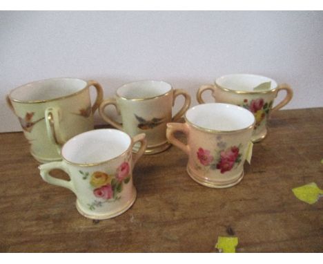 Five Royal Worcester miniature blush ivory mugs and loving cups, decorated with birds and flowers