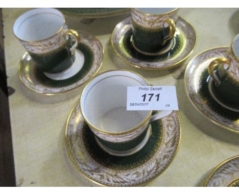 Six Spode green and gilt coffee cans and saucers