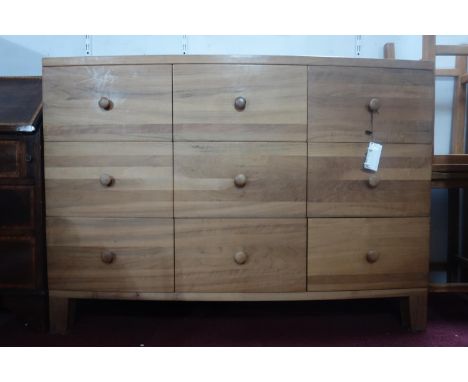 A contemporary hardwood bow fronted chest of 7 drawers, H.114 W.105 D.49cm 