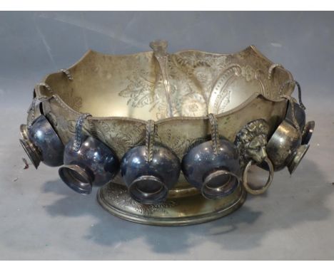 A Victorian silver plated punch bowl, nine cups and ladle (11) 