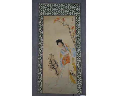 A Chinese watercolour of an elegant lady by a tree, signed and with red seal mark, with geometric patterned textile border, u