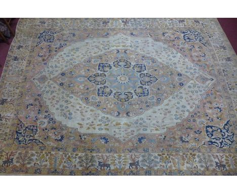 An antique Persian Tabriz Hajili carpet, c.1880's, central floral medallion and petal motifs on a cream ground, within zoomor