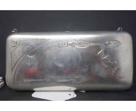 An early 20th century Russian silver clutch purse, engraved with monogram and floral decoration, with cabochon button, hallma