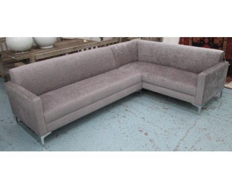 CORNER SOFA, contemporary design, in shimmering silver/grey upholstery raised on chrome legs, 260cm x 185cm.