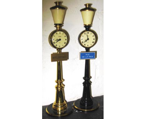 TABLE CLOCKS, two similar, by Jaegger Le Coultre, in the form of lamp posts, each variously with street sign 'April Cottage' 