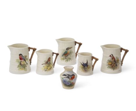 Set of five early 20th century Royal Worcester jugs all painted with birds by William Powell, the jugs with brown twig like h