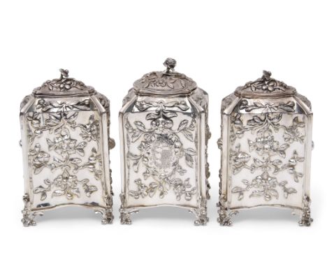 Fine set of three early George III tea caddies of bombe sided rectangular and square form, each bearing an armorial crest to 