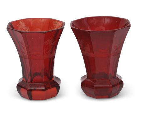 Pair of Bohemian ruby red vases of octagonal shape, the vases engraved with various hunting subjects above a shaped foot and 