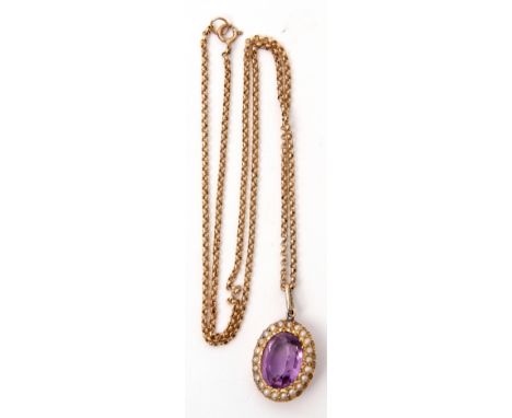 Antique amethyst and seed pearl pendant, the oval shaped faceted amethyst within a seed pearl surround, stamped 15ct, suspend