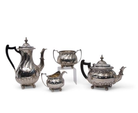 Late Victorian four-piece tea and coffee service in rococo style with heavily chased and embossed fluting and gadrooning thro