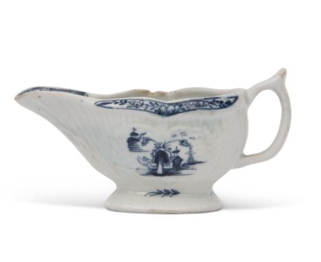Small Lowestoft porcelain sauce boat, the reeded body with two panels decorated in underglaze blue with a chinoiserie design,