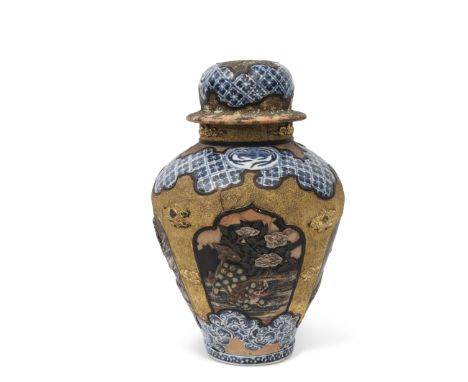 Impressive Arita porcelain jar and cover circa 1700, decorated in Shibayama style, the baluster body with panels of blue and 