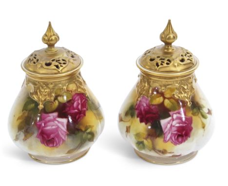 Pair of Royal Worcester pot pourri vases with gilt reticulated covers, painted with roses, one signed by Spilsbury, the other