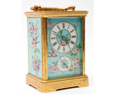 Last quarter of 19th/1st quarter of 20th century ornate brass and glass cased carriage clock having floral and bird painted s