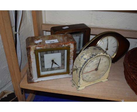 Three mantel clocks together with a timer