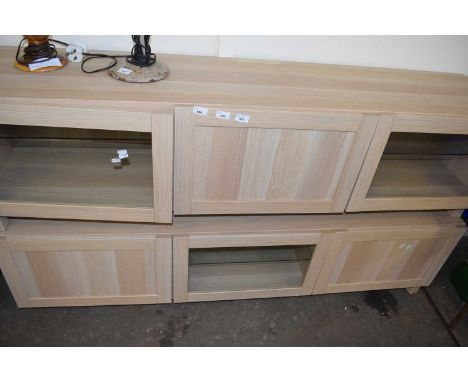 Pair of modern light wood finish lounge cabinets with glazed doors, 180cm wide