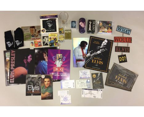 ELVIS MIXED MEMORABILIA. Lot of mixed memorabilia to include: a 1998 'song captions' single use camera, an Elvis cologne, Elv