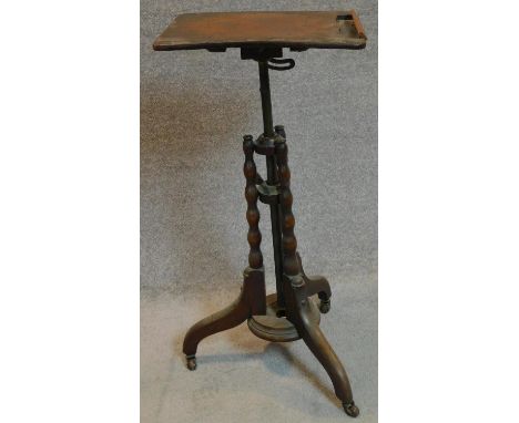 A mid Victorian burr walnut adjustable and articulated music stand on bobbin turned tripod supports. 80x38cm 