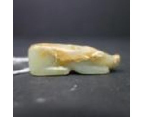 A 19th century Chinese carved jade pendant in the form of a pig, H.1.6 W.5 D.1.2cm 