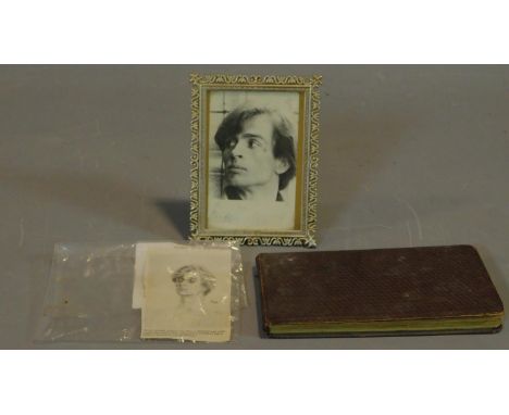 A signed framed portrait of Nuryev and an autograph book of classical music interest. 