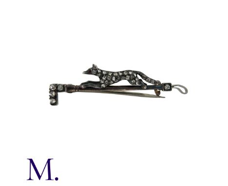 A Diamond-Set Fox And Riding Crop Brooch in silver and gold, comprising a running box on a riding crop bar, set with rose cut