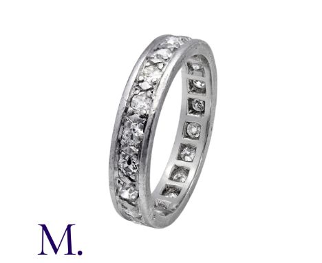 A Diamond Eternity Ring in 18K white gold and platinum, set with round cut diamonds weighing approximately 0.90cts in total.S