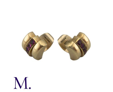 A Pair of Ruby Earclips in 9K yellow gold, each set with six rubies.Size: 1.8cmWeight: 10.7g 