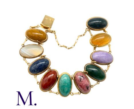 An Antique Hardstone Bracelet in yellow gold, set with oval cabochons of various agate and other hardstones.Size: 17cmWeight: