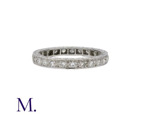 A Diamond Eternity Ring in platinum set with approximately 0.50ct of diamonds, with engraved sides. Unmarked but tests indica