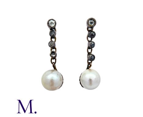 A Pair of Antique Pearl and Diamond Earrings in yellow gold and silver, each comprising an articulated row of four old cut di