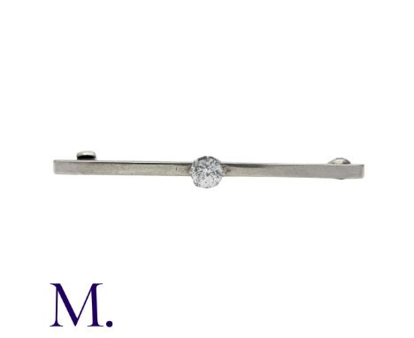 A Diamond Bar Brooch in 9K white gold, set with an old cut diamond weighing approximately 0.35ct to the centre. Stamped 9ct.S