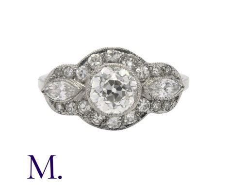 A Diamond Ring in white gold set with a principal diamond weighing approximately 0.90ct  with two marquise diamonds either si