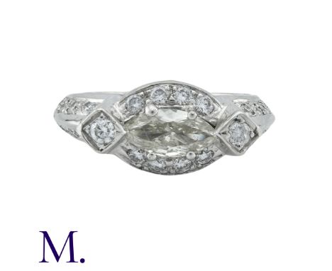 A Diamond Ring, in 18k white gold, set with a principal marquise cut stone of approximately 0.50cts with further diamond acce