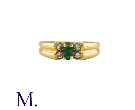 VAN CLEEF & ARPELS. An Emerald and Diamond Butterfly Ring in 18K yellow gold, set with a navette emerald and four brilliant c