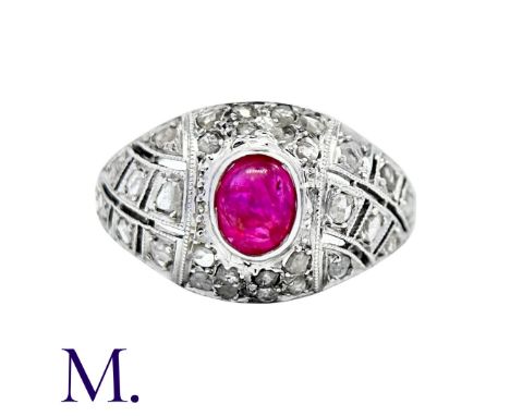 An Antique Ruby and Diamond Bombe Ring in platinum, set with a cabochon ruby (accompanied with a gemological report stating t