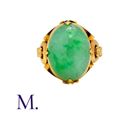 A Jade Ring in yellow gold, set with an oval jade cabochon.  Band marked internally with Chinese marks.Size: M1/2Weight: 6.2g