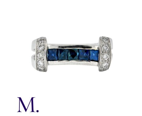 A Sapphire and Diamond Ring in 18K white gold, set with approximately 0.25ct of round cut diamonds with five faceted square c