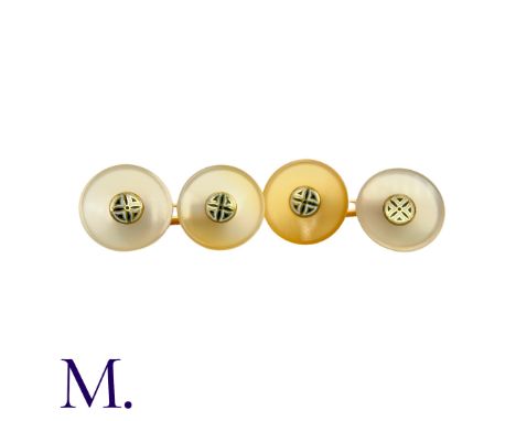 A Pair of Hardstone Cufflinks in 18K yellow gold, with 14mm diameter circular discs of cream-brown hardstone inlaid with enam