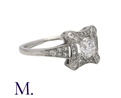 A Diamond Ring in platinum, set with a round cut diamond to the centre of approximately 0.60ct, with diamonds in surround and